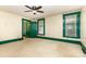 Spacious bedroom with green trim, neutral walls, and ample natural light at 14115 Old Statesville Rd, Huntersville, NC 28078