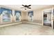 Bright bedroom with three windows and classic wallpaper accents at 14115 Old Statesville Rd, Huntersville, NC 28078