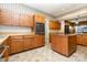 Well-equipped kitchen with oak cabinets and stainless steel oven at 14115 Old Statesville Rd, Huntersville, NC 28078