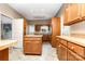 Functional kitchen with oak cabinets, island and linoleum flooring at 14115 Old Statesville Rd, Huntersville, NC 28078
