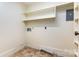 Laundry room with shelves providing ample storage and organization space at 14115 Old Statesville Rd, Huntersville, NC 28078