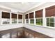 A sunroom filled with natural light and a mini-split air conditioner providing a relaxing atmosphere at 14115 Old Statesville Rd, Huntersville, NC 28078