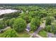 A stunning aerial view of a house surrounded by lush greenery and mature trees in a tranquil neighborhood at 1425 3Rd Street Ne Pl, Hickory, NC 28601