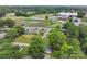 An aerial view of the house with a nearby football field and schools at 1425 3Rd Street Ne Pl, Hickory, NC 28601
