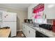 Traditional kitchen featuring stainless steel sink, granite countertops, and white cabinetry at 1425 3Rd Street Ne Pl, Hickory, NC 28601