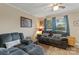 Comfortable living room with plush seating, a ceiling fan, and natural light at 1425 3Rd Street Ne Pl, Hickory, NC 28601
