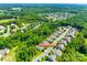 Aerial view of a residential neighborhood with tree-lined streets and well-maintained homes at 14727 Brannock Hills Dr, Charlotte, NC 28278