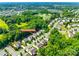 Aerial view of a residential neighborhood with tree-lined streets and well-maintained homes at 14727 Brannock Hills Dr, Charlotte, NC 28278
