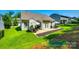Aerial view of a backyard featuring lush green grass and a cozy patio area at 14727 Brannock Hills Dr, Charlotte, NC 28278