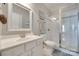 Bright bathroom with a glass enclosed shower, tile floors, and a vanity with ample counter space at 14727 Brannock Hills Dr, Charlotte, NC 28278