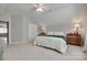 Cozy bedroom with carpet, lamps, a bed, and dresser creating a comfortable and inviting space at 14727 Brannock Hills Dr, Charlotte, NC 28278