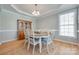 Elegant dining room featuring hardwood floors, a chandelier, and a decorative china cabinet at 14727 Brannock Hills Dr, Charlotte, NC 28278