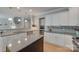 A kitchen features a black granite island, light cabinets, and tiled backsplash at 14727 Brannock Hills Dr, Charlotte, NC 28278