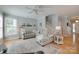 Bright living room features a cozy sectional sofa, hardwood floors, and staircase access at 14727 Brannock Hills Dr, Charlotte, NC 28278
