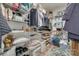 Spacious walk-in closet with ample shelving and organized storage solutions for clothes, shoes, and accessories at 14727 Brannock Hills Dr, Charlotte, NC 28278