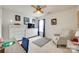Bright bedroom features a ceiling fan, a chair, and tasteful decor for a comfortable and stylish space at 1583 Cold Creek Pl, Huntersville, NC 28078