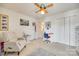 Bright bedroom with comfortable chair, desk, and closet space provides a cozy, functional area at 1583 Cold Creek Pl, Huntersville, NC 28078