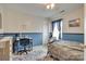 Comfortable bedroom with soft blue color scheme, carpet, and furnishings at 1583 Cold Creek Pl, Huntersville, NC 28078