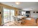 Bright dining area with sliding glass doors leading to outdoor patio and connected to the living area at 1583 Cold Creek Pl, Huntersville, NC 28078