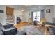 Bright and airy living area features hardwood floors, neutral walls, and comfortable seating arrangement at 1583 Cold Creek Pl, Huntersville, NC 28078