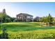 View of a spacious backyard with a charming wooden bridge and meticulously maintained lawn, ideal for outdoor activities at 159 Holly Ridge Dr, Mooresville, NC 28115