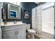 Clean and modern bathroom featuring a vanity, toilet, and shower with a stylish shower curtain at 159 Holly Ridge Dr, Mooresville, NC 28115