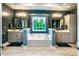 Luxurious bathroom featuring separate vanities, a soaking tub, and elegant lighting fixtures at 159 Holly Ridge Dr, Mooresville, NC 28115