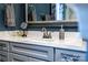 Bathroom vanity with gray cabinets, white countertop, and silver faucet at 159 Holly Ridge Dr, Mooresville, NC 28115