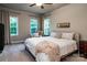 Spacious bedroom with natural light from large windows, neutral walls and cozy decor at 159 Holly Ridge Dr, Mooresville, NC 28115