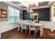 Elegant dining room with hardwood floors, chandelier, and a window with natural light at 159 Holly Ridge Dr, Mooresville, NC 28115