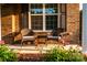 Inviting front porch with comfortable seating and charming details, framed by blooming flowers at 159 Holly Ridge Dr, Mooresville, NC 28115