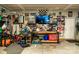 Organized garage space with ample storage, tool organization, and decorative items, ideal for car enthusiasts and hobbyists at 159 Holly Ridge Dr, Mooresville, NC 28115