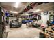Spacious garage featuring a car, golf cart, motorcycle, and home gym equipment, offering versatility and ample storage space at 159 Holly Ridge Dr, Mooresville, NC 28115