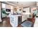 Kitchen island with stainless steel appliances and opens to the adjacent living room at 159 Holly Ridge Dr, Mooresville, NC 28115