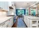 Kitchen with long countertops, stainless steel appliances and an adjacent dining space at 159 Holly Ridge Dr, Mooresville, NC 28115