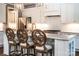 Kitchen with stainless appliances, light countertops and three bar stools at 159 Holly Ridge Dr, Mooresville, NC 28115