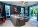 Cozy living room with a large sectional sofa, natural light, and access to the outdoor patio at 159 Holly Ridge Dr, Mooresville, NC 28115