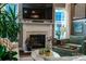 Living room with fireplace, large windows, and comfortable seating at 159 Holly Ridge Dr, Mooresville, NC 28115