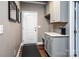 Functional mud room features built-in storage, a countertop, and convenient access to the outdoors at 159 Holly Ridge Dr, Mooresville, NC 28115