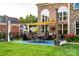 Cozy backyard patio with comfortable seating, dining area, and ambient lighting at 159 Holly Ridge Dr, Mooresville, NC 28115