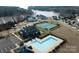 Aerial view of community amenities: pool, tennis, and lake at 16142 Commodore Dr, Lancaster, SC 29720