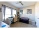 Comfortable bedroom featuring a desk, sofa and two windows at 16142 Commodore Dr, Lancaster, SC 29720