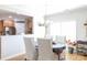 Bright dining area with views into the kitchen, featuring a round table and comfortable seating at 16142 Commodore Dr, Lancaster, SC 29720
