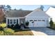 Charming single-story home with a well-maintained lawn and a delightful snowman decal on the garage door at 16142 Commodore Dr, Lancaster, SC 29720