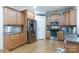 Spacious kitchen featuring stainless steel appliances, ample counter space, and wooden cabinets at 16142 Commodore Dr, Lancaster, SC 29720