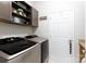 Bright laundry room with washer and dryer, shelving, and door at 16142 Commodore Dr, Lancaster, SC 29720