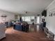 Spacious living room with wood floors, modern decor, and lots of natural light at 16142 Commodore Dr, Lancaster, SC 29720