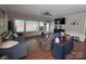 Cozy living room with hardwood floors, TV, and neutral paint at 16142 Commodore Dr, Lancaster, SC 29720
