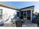 Inviting outdoor patio area with a dining table, chairs, and a screened-in porch at 16142 Commodore Dr, Lancaster, SC 29720