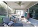 Relaxing screened porch with seating and wooded views at 16142 Commodore Dr, Lancaster, SC 29720